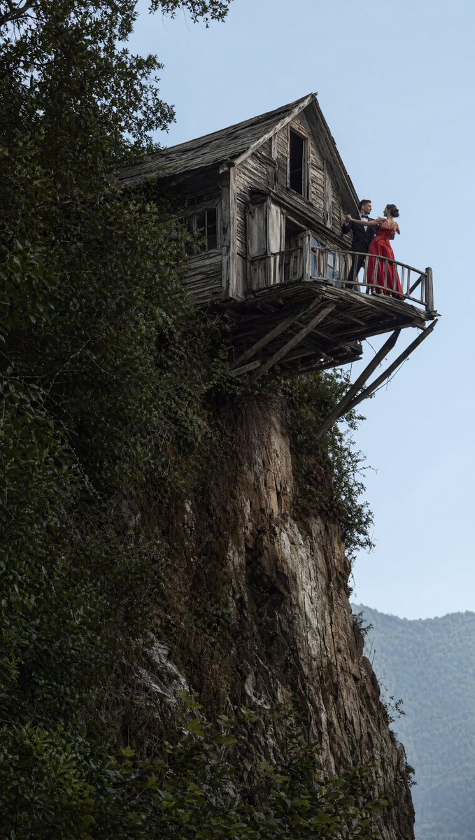 Dancing Couple on Cliffside House - GPT Image 2 prompt example