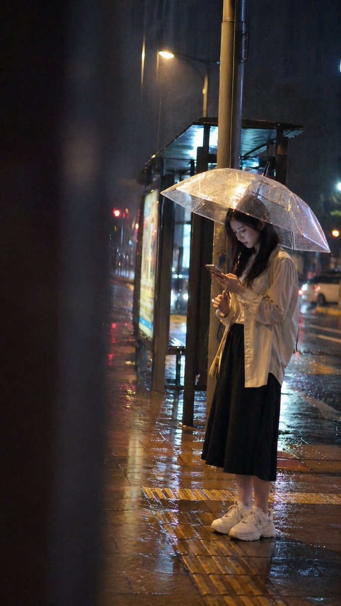 Cinematic rainy night bus stop prompt - GPT Image 2 prompt example