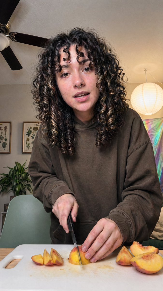Cozy Indoor Peach Slicing Portrait - GPT Image 2 prompt example